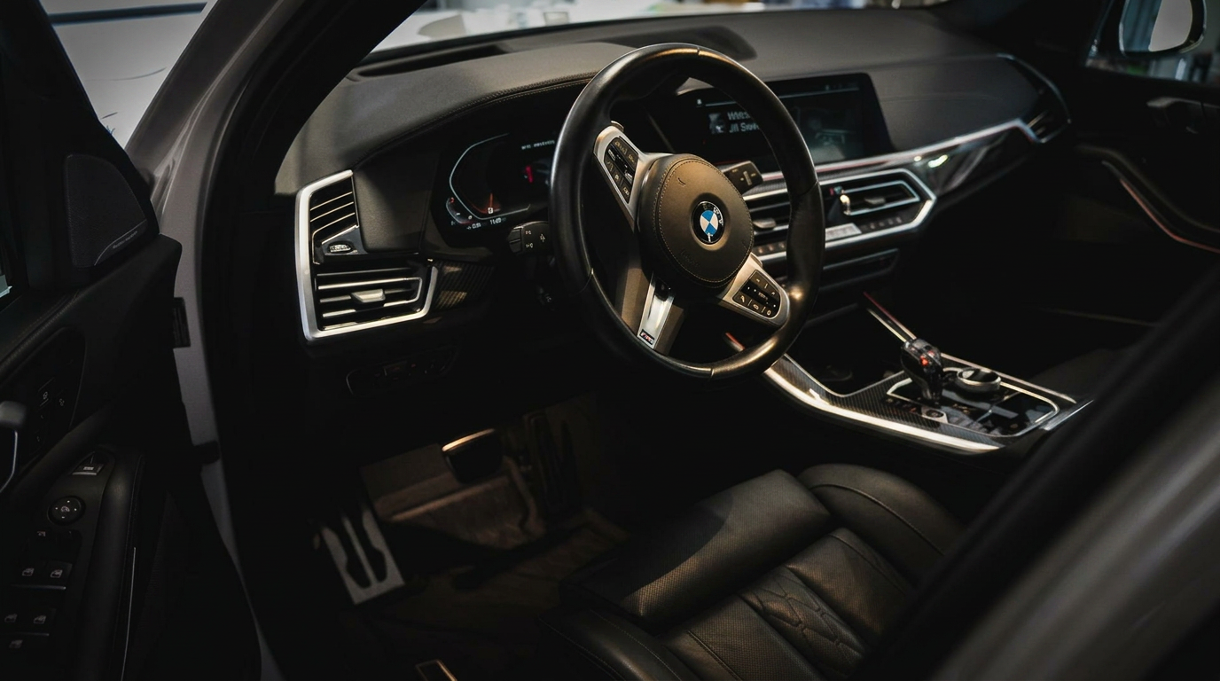 Luxury BMW interior detailed with rich black leather and polished trim